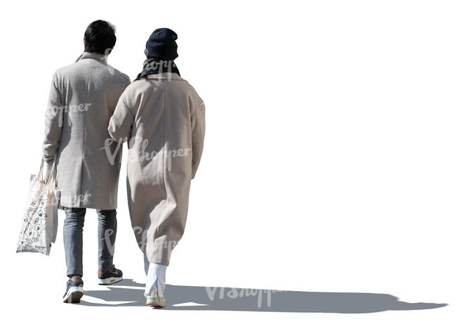 cut out sidelit couple in light spring coats walking