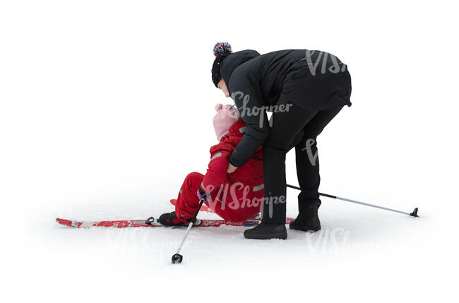 cut out woman helping her daughter up when skiing