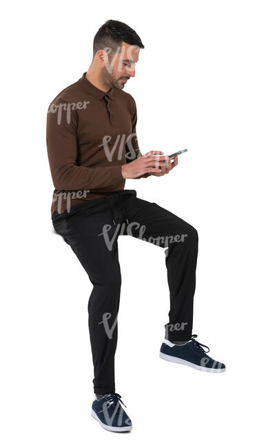 cut out man sitting on a table and looking at his phone