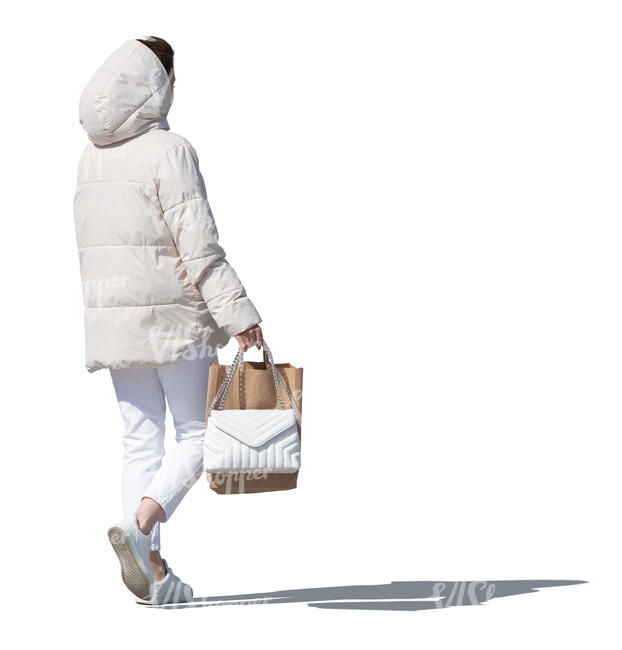 cut out woman in a white hooded jacket and carrying a shopping bag walking