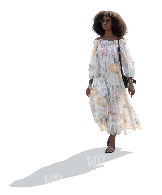 cut out backlit woman in a summer dress walking