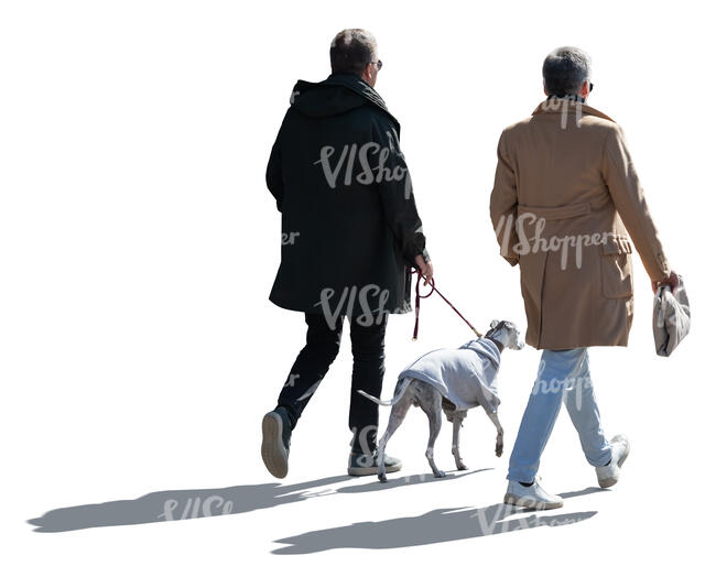 two cut out backlit men and a dog walking