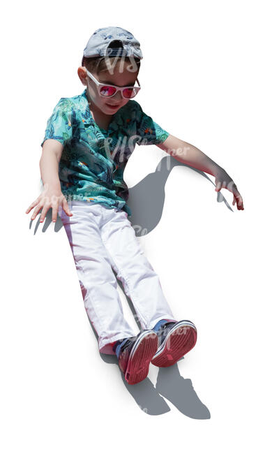 cut out boy sliding down on a slide on a playground