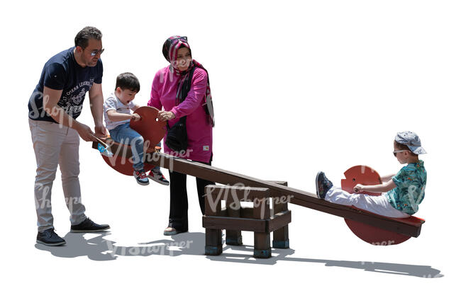 cut out backlit middle east family playing on the playground