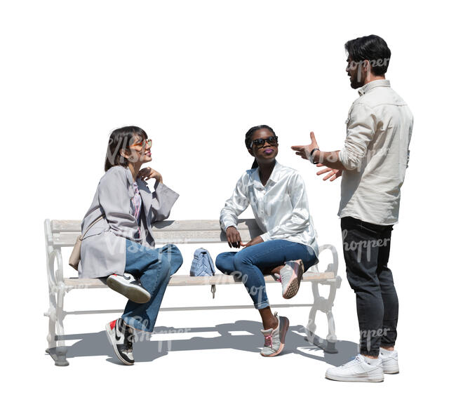 cut out man standing and talking to two women sitting