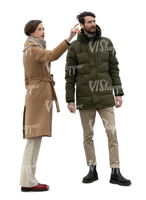 two cut out people in autumn standing outside