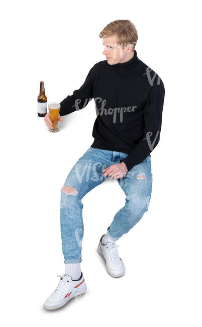 cut out man sitting and drinking beer seen from above