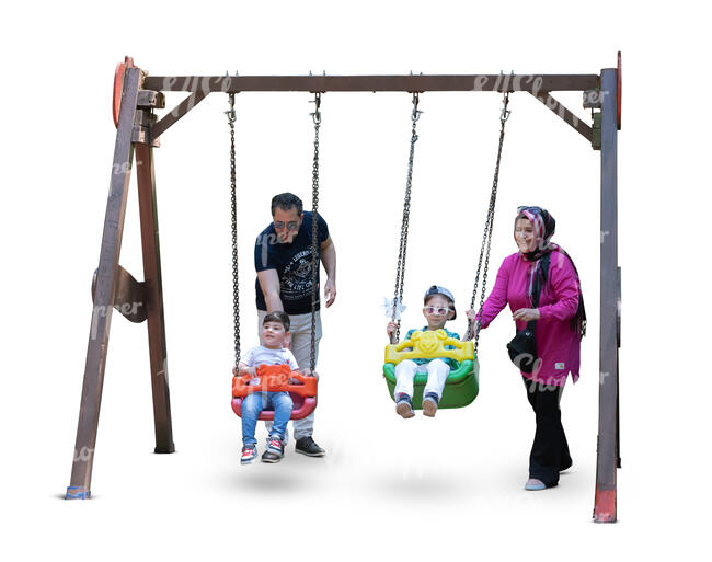 cut out middle east family with the kids playing at the playground and swinging