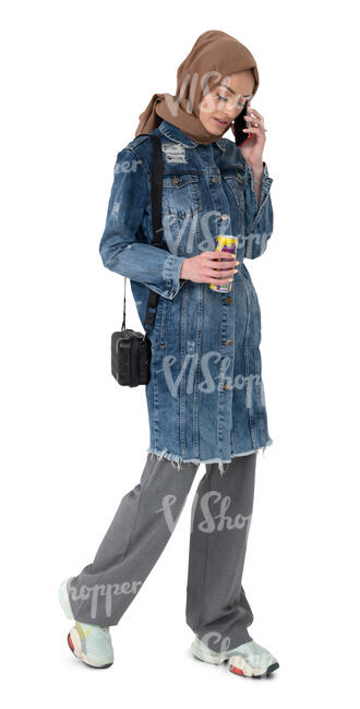 cut out muslim woman walking and talking on a phone