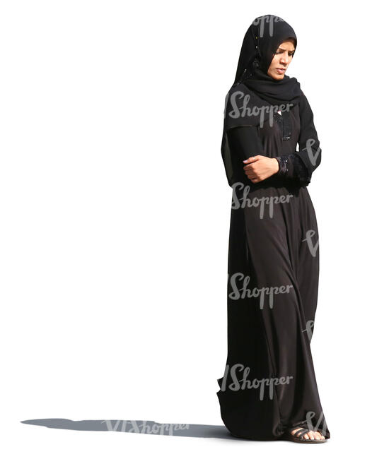 muslim woman in a black abaya walking