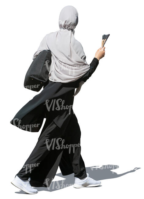 muslim woman walking hastily