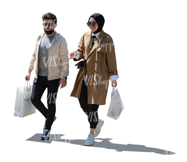 two cut out backlit young muslim people walking