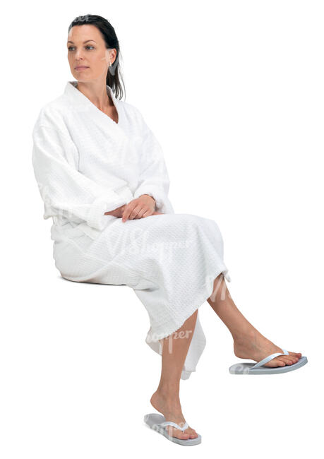 cut out woman in a white bathrobe sitting