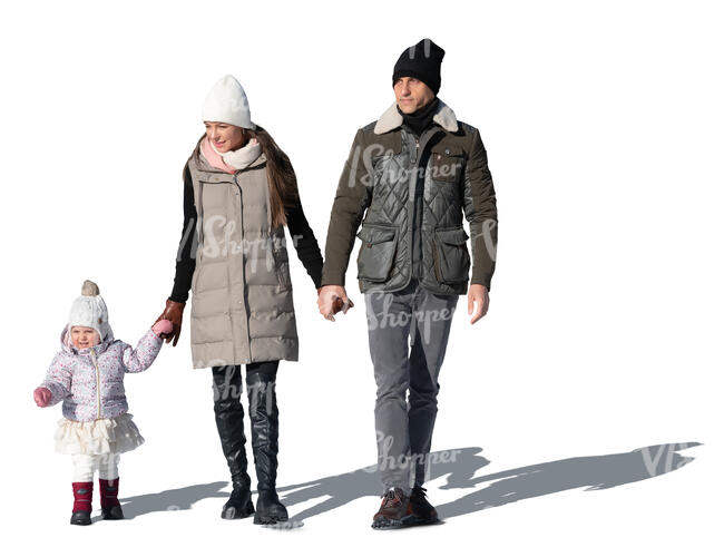 cut out family with a baby girl walking on a sunny winter day