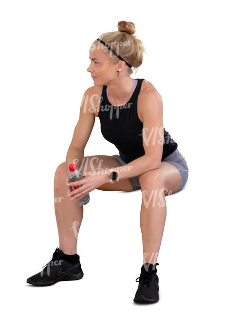 cut out woman at a gym taking a break and sitting