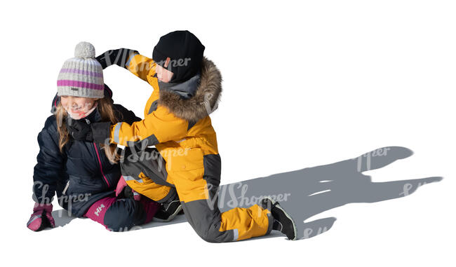 two cut out kids in winter playing outside