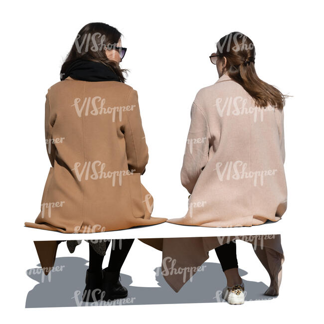 two cut out women in overcoats sitting and talking