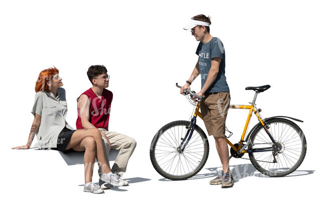 cut out young man with a bike talking to two friends sitting on a bench