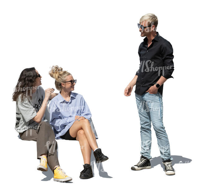 cut out man standing and talking to two women sitting on a bench