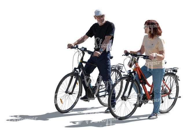 cut out backlit man and woman on bikes stopping and talking
