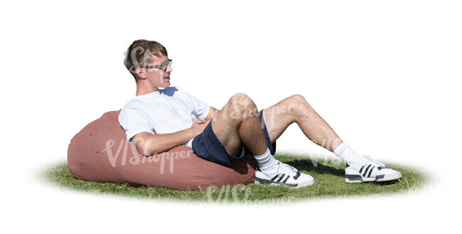 cut out young man sitting outside on a bean bag chair