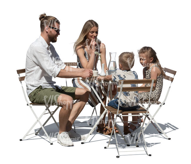 cut out family in a an outdoor restaurant sitting and eating