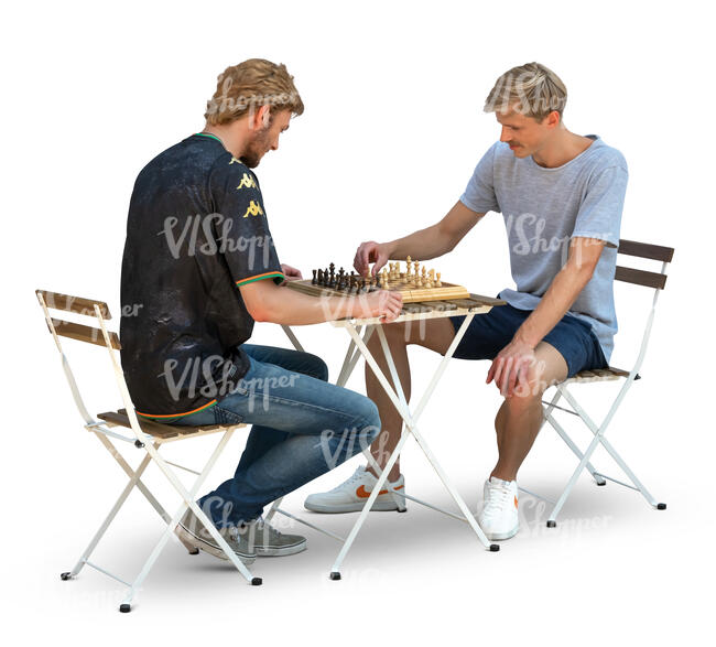 two cut out men sitting at a table and playing chess