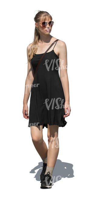 cut out woman in a black summer dress walking