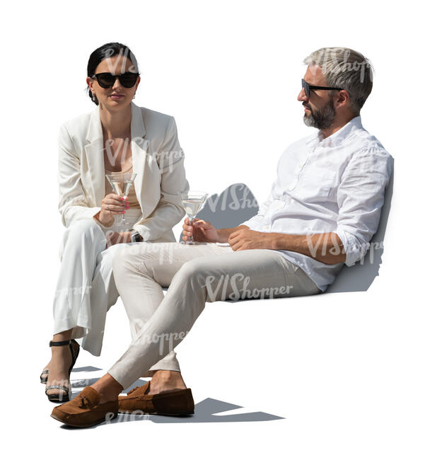cut out man and woman sitting and drinking martini cocktails