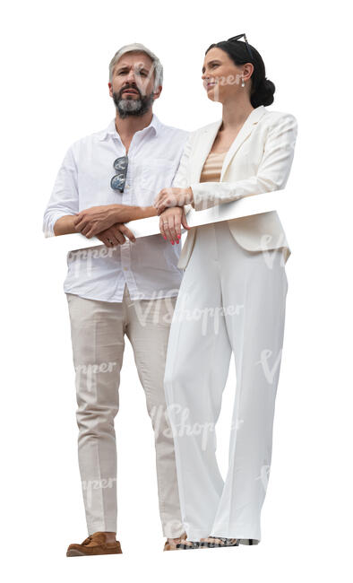 cut out man and woman in white summer clothes standing on a balcony