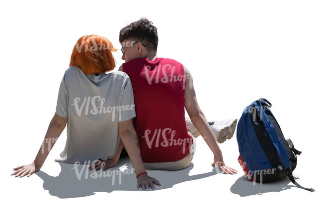 cut out backlit young teenage couple sitting