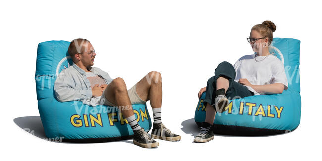cut out man and woman sitting on outdoor bean bag chairs