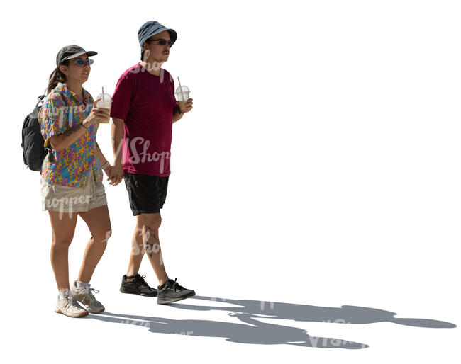 cut out backlit couple from south america walking and drinking ice drinks