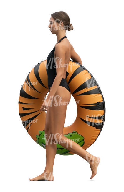 cut out woman with a big swim ring walking on the beach
