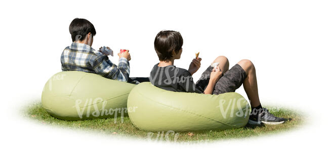 two cut out boys sitting outside on bean chairs and eating hamburgers