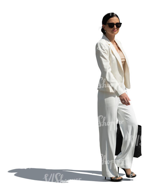 cut out woman in a white suit walking