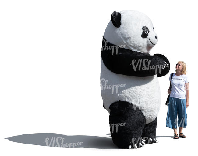 woman standing next to a giant panda