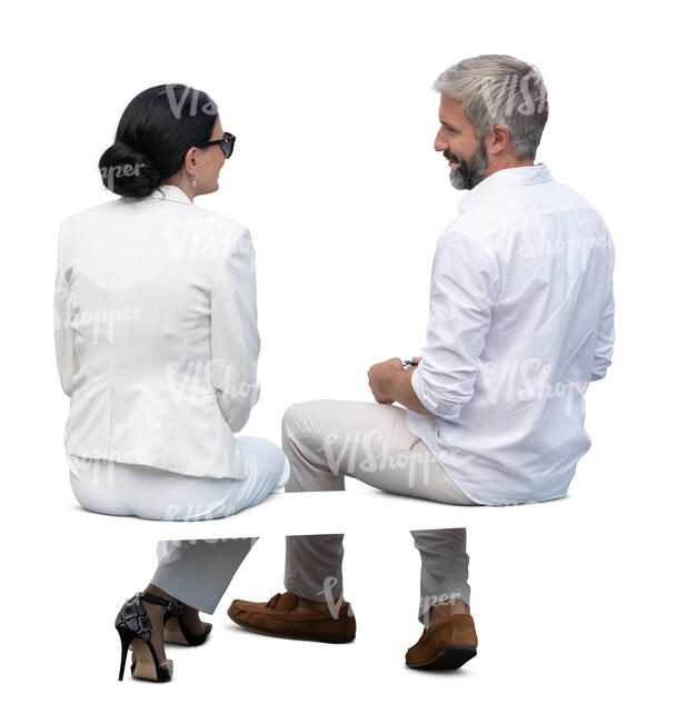 man and woman sitting and talking seen from back angle