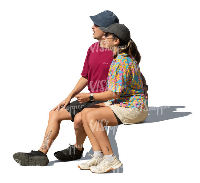 south american couple sitting and looking in one direction
