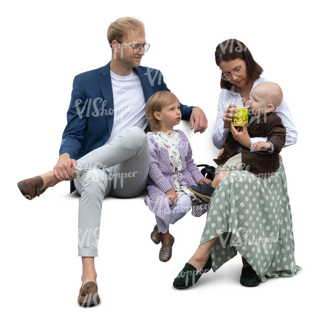 family with little kids sitting and having a snack