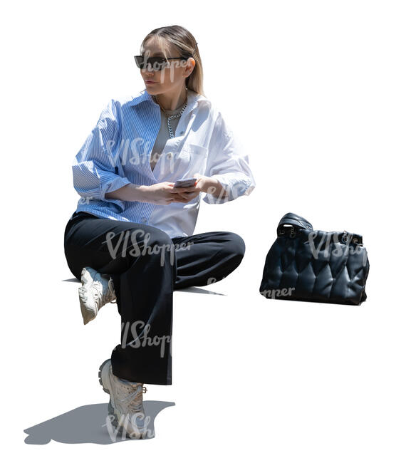 backlit asian woman sitting