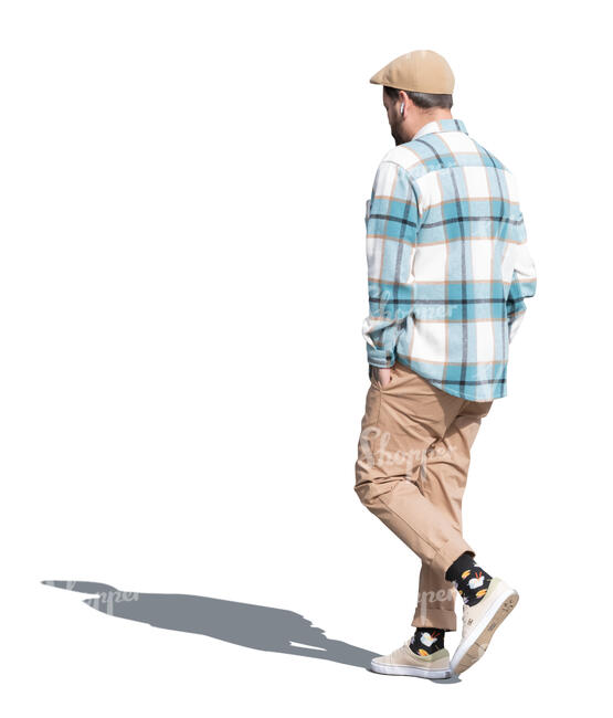 man with a checkered shirt and a hat walking