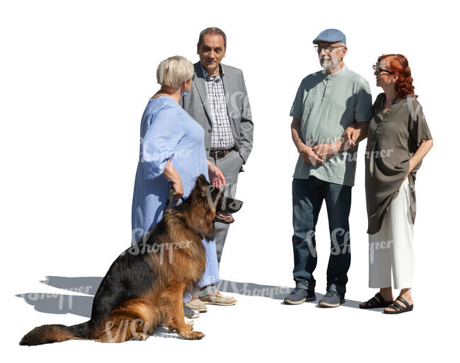 group of older people with a dog standing and talking