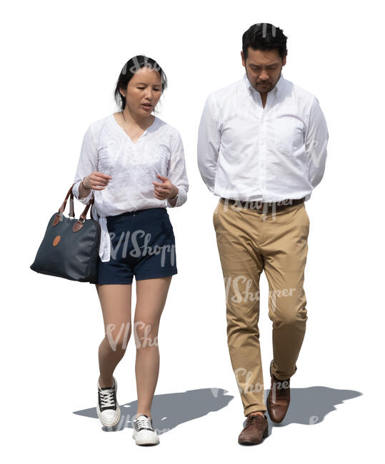 two asian people walking side by side