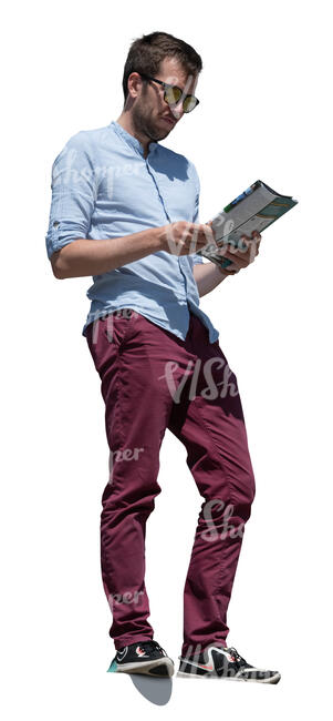 man standing on a higher floor and reading a magazine