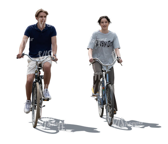 two backlit people cycling