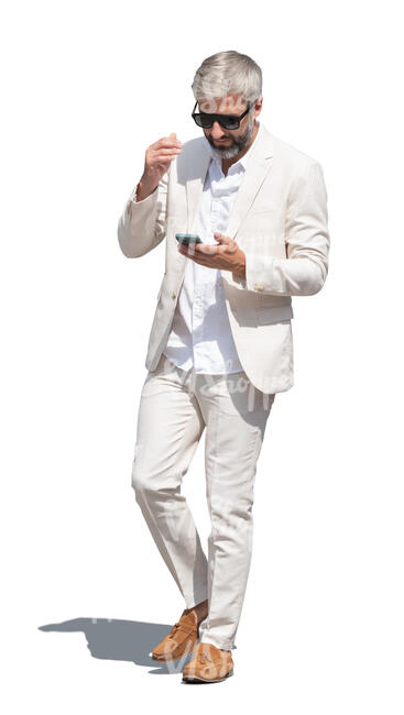 cut out man in a white suit walking