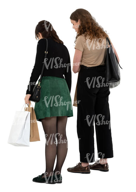 two women standing in a shop and looking down on a counter