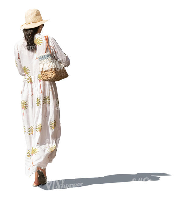 woman with a hat and waring a summer dres walking