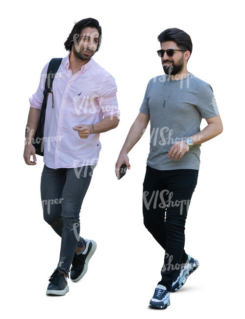 two dark haired men walking and talking